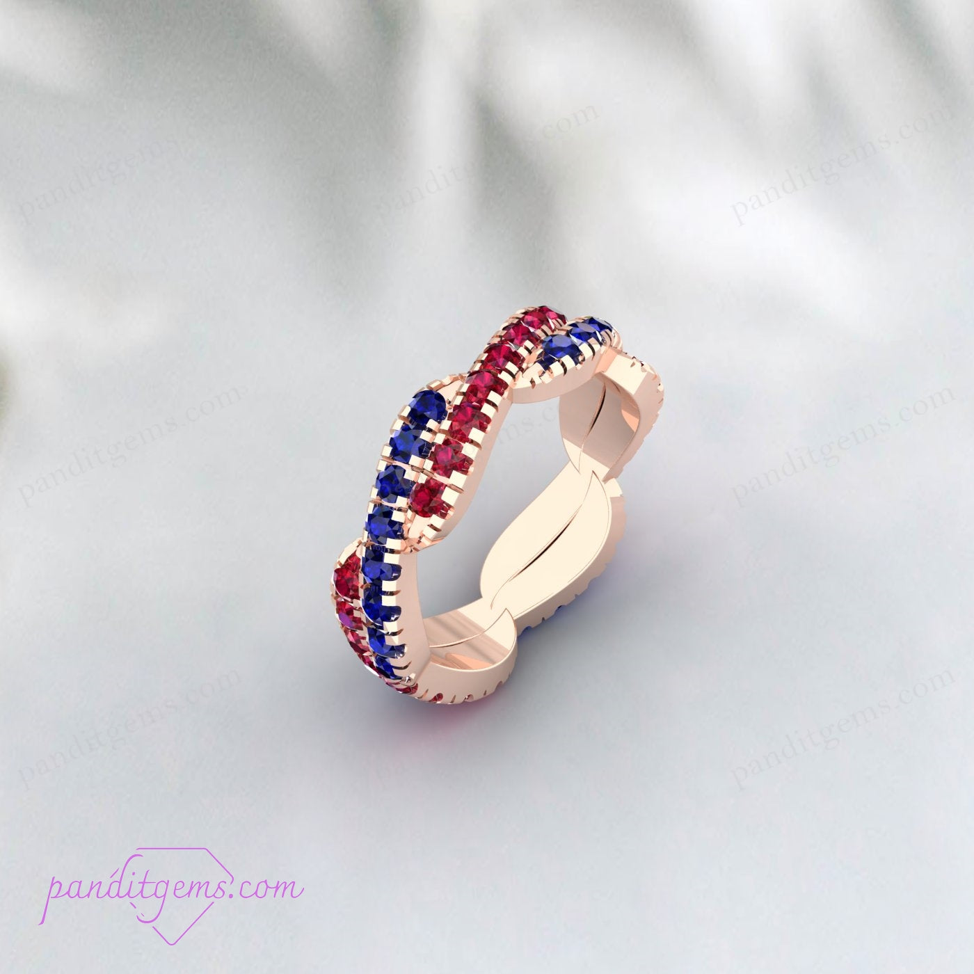 925 Sterling Silver Blue Sapphire and Ruby Infinity Ring with a unique twisted design, perfect as a promise ring.