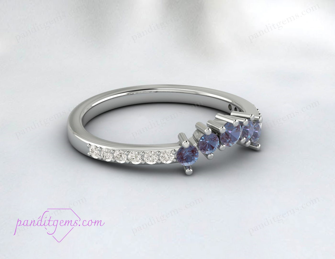 A ring with Alexandrite, the birthstone for June, set in a curved V band.