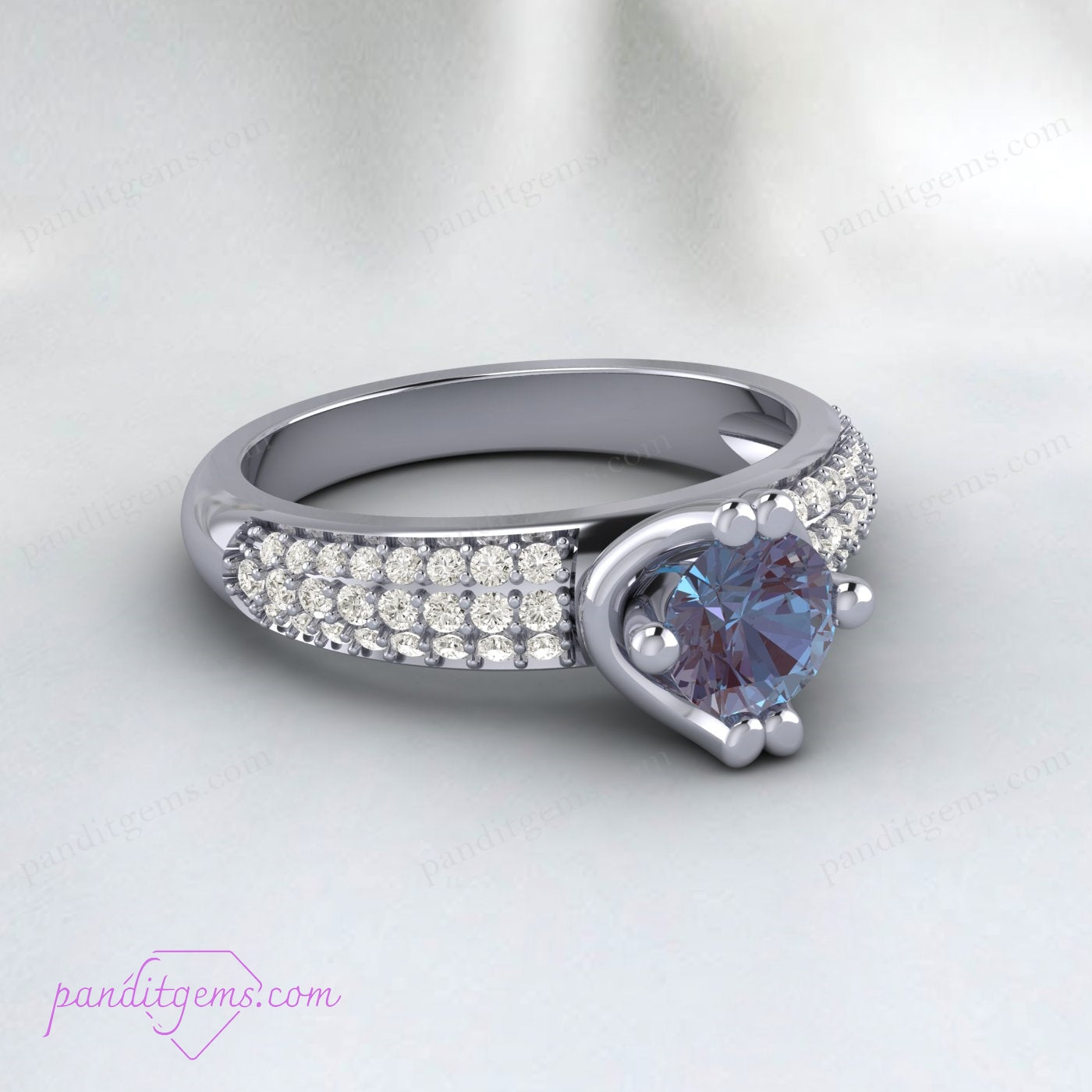 Alexandrite bridal ring with a color-changing gemstone in a curved setting.