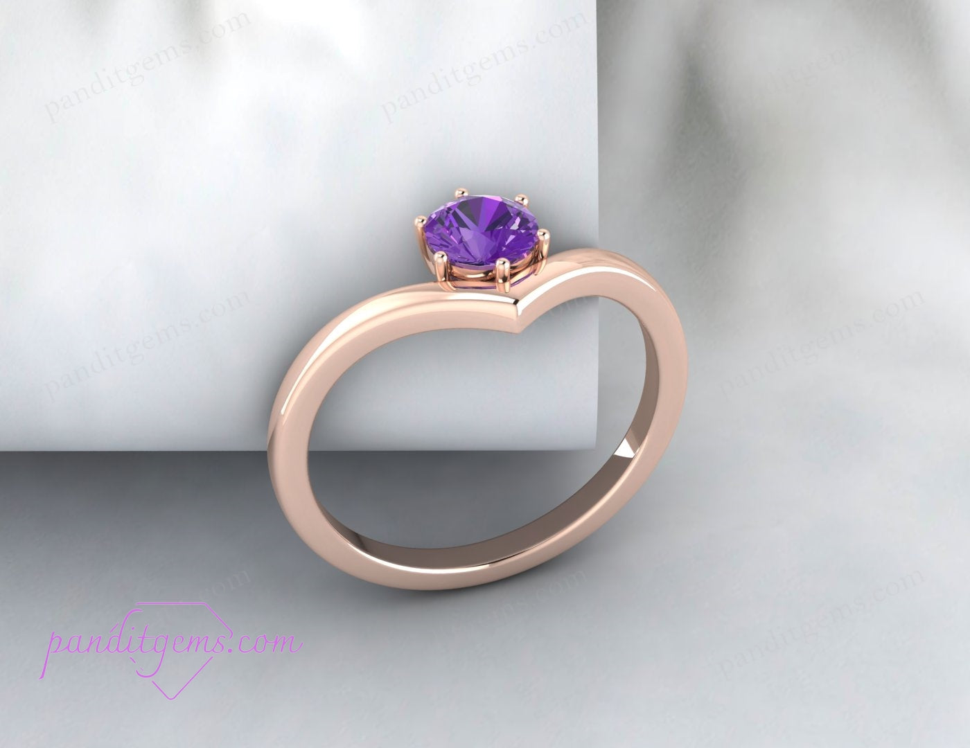 Amethyst solitaire ring in a unique V-shape design, crafted in sterling silver with a round purple gemstone. Ideal for birthdays or anniversaries.