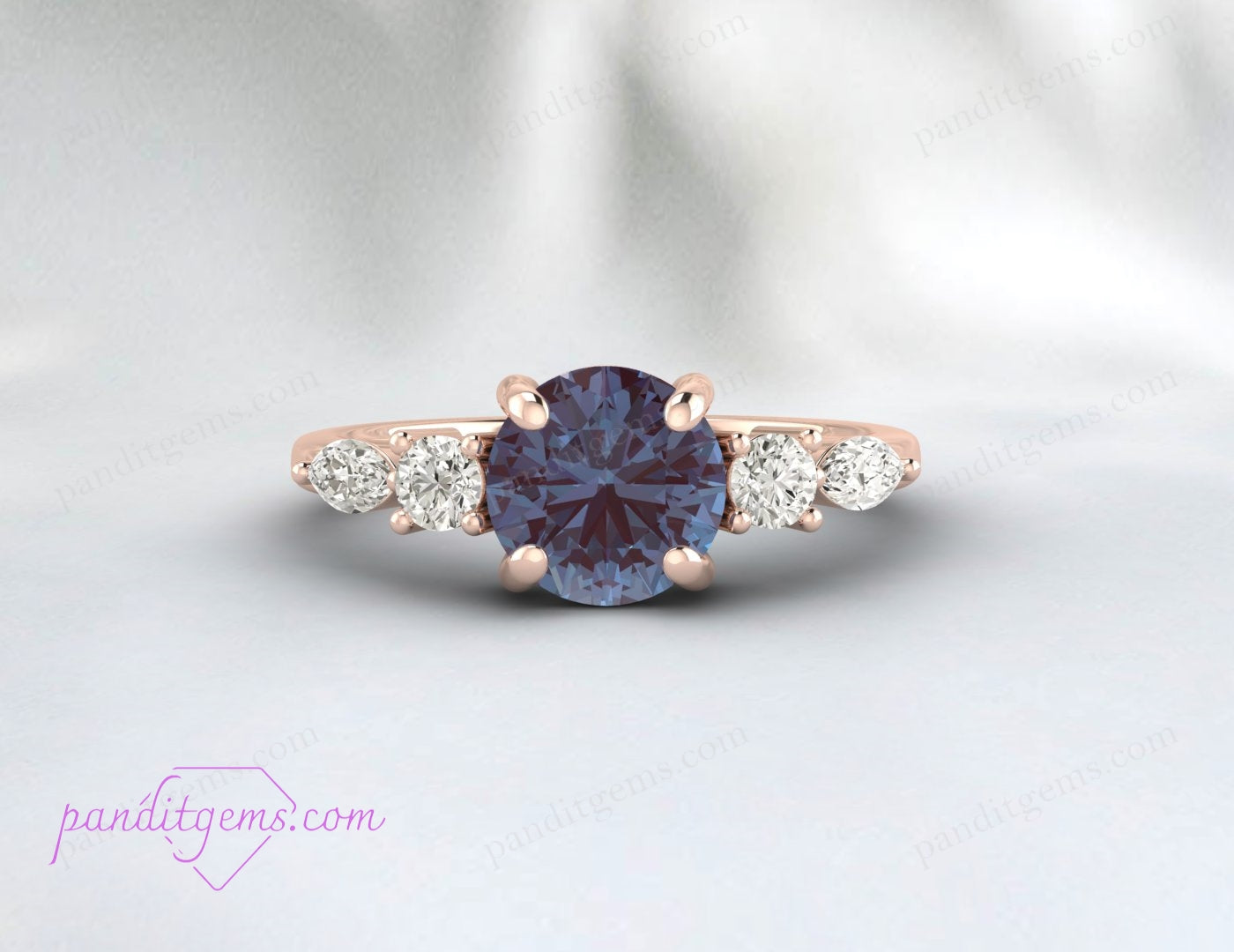 Close-up of Alexandrite ring with marquise diamond accents.