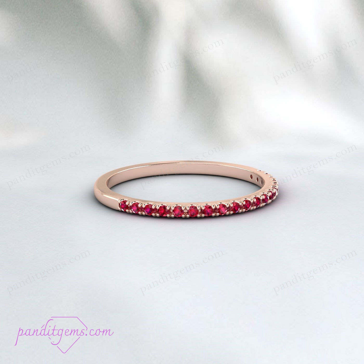 Close-up view of the 1.5mm natural rubies in a half eternity pave setting.