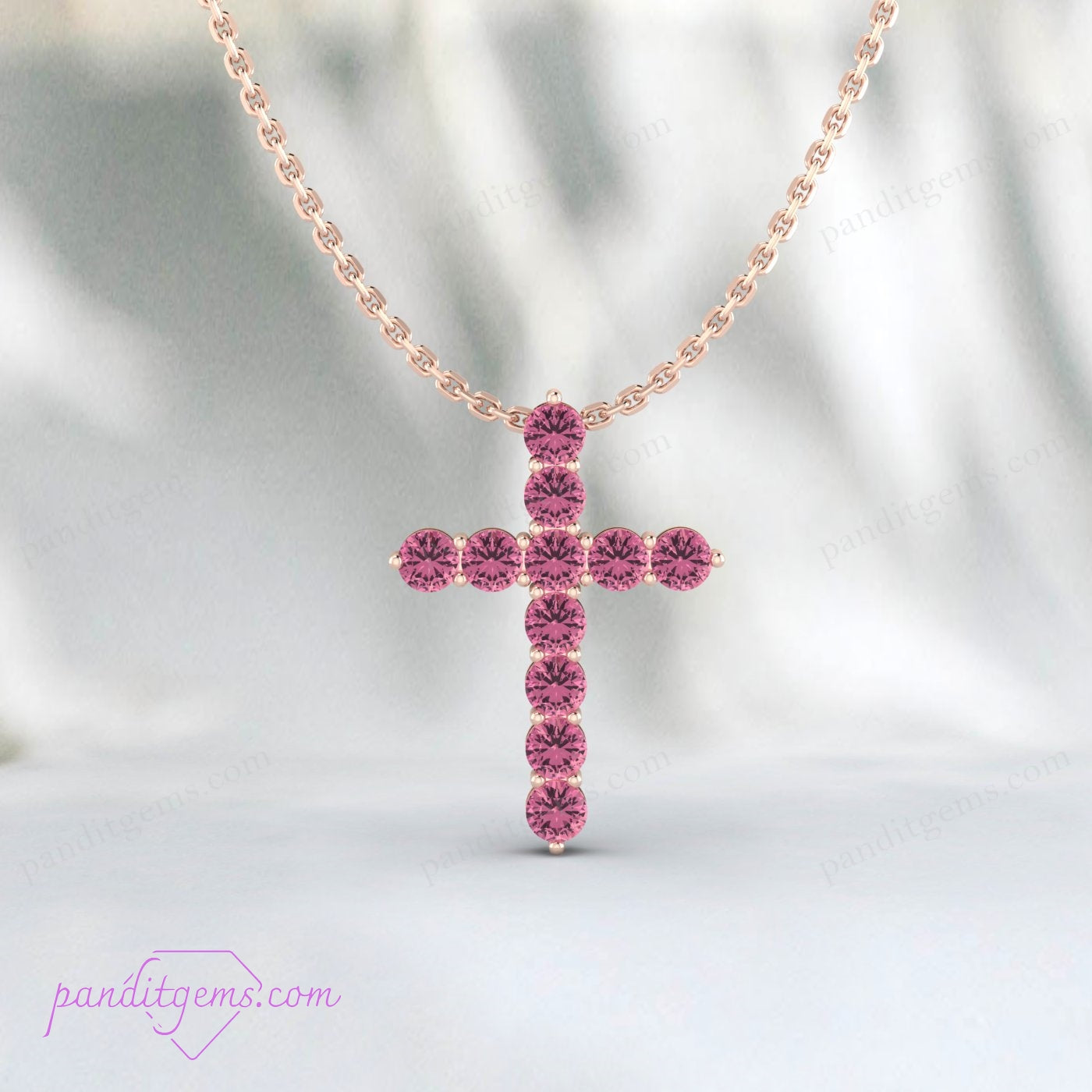 Close-up of a Pink Tourmaline cross pendant in 925 sterling silver, perfect gift for October birthdays.