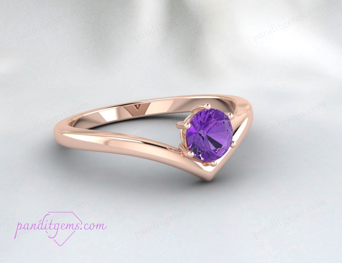 Close-up view of the round-cut amethyst gemstone set in a 925 sterling silver V-shaped band, showcasing its elegant simplicity.