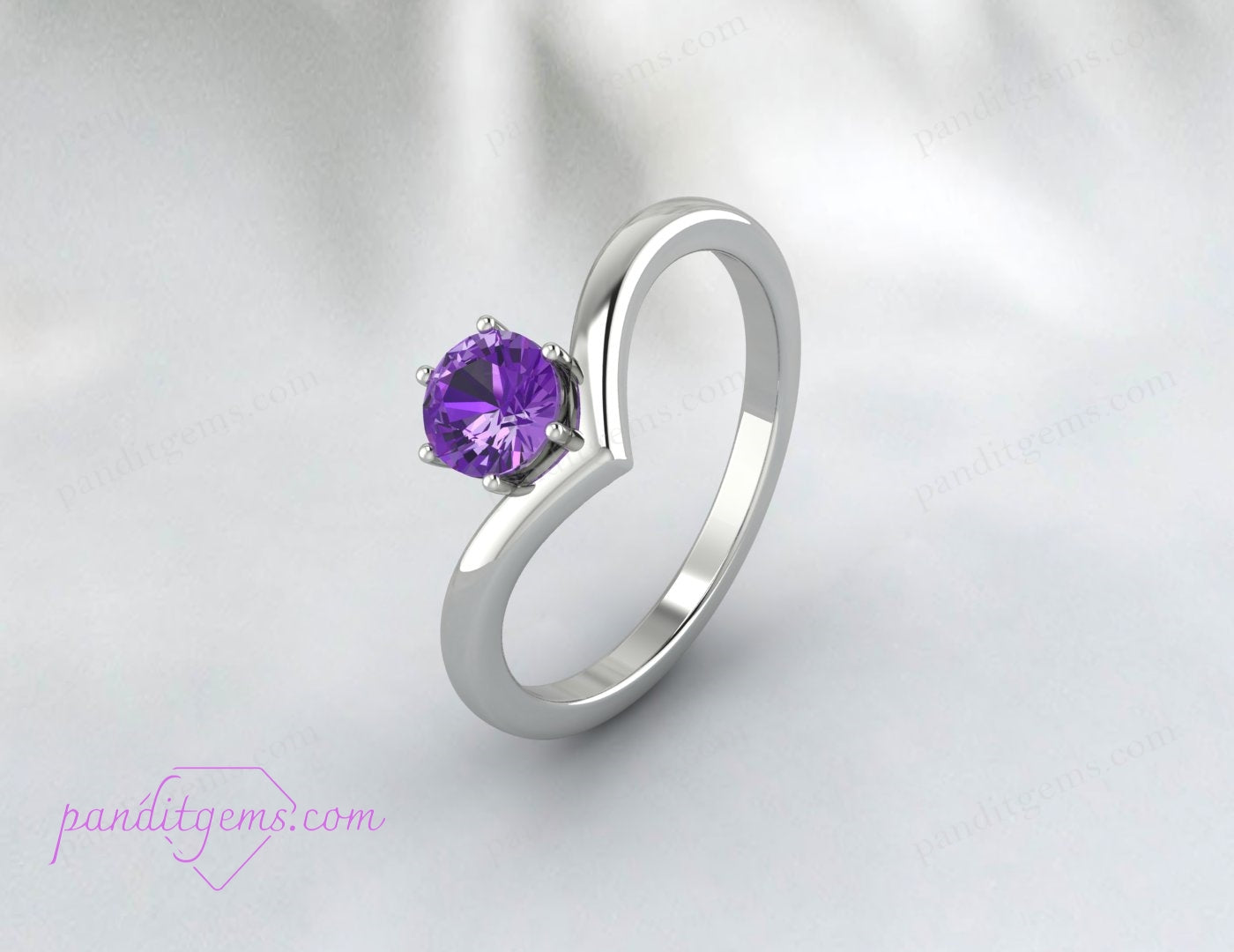 Dainty silver ring with a round amethyst solitaire stone, designed in a V-shaped chevron band, ideal for everyday elegance.