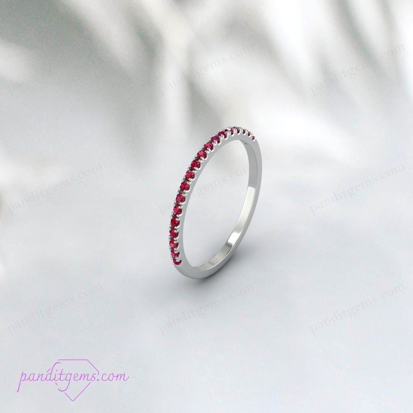 Detailed image showing the intricate setting of the rubies in the band.