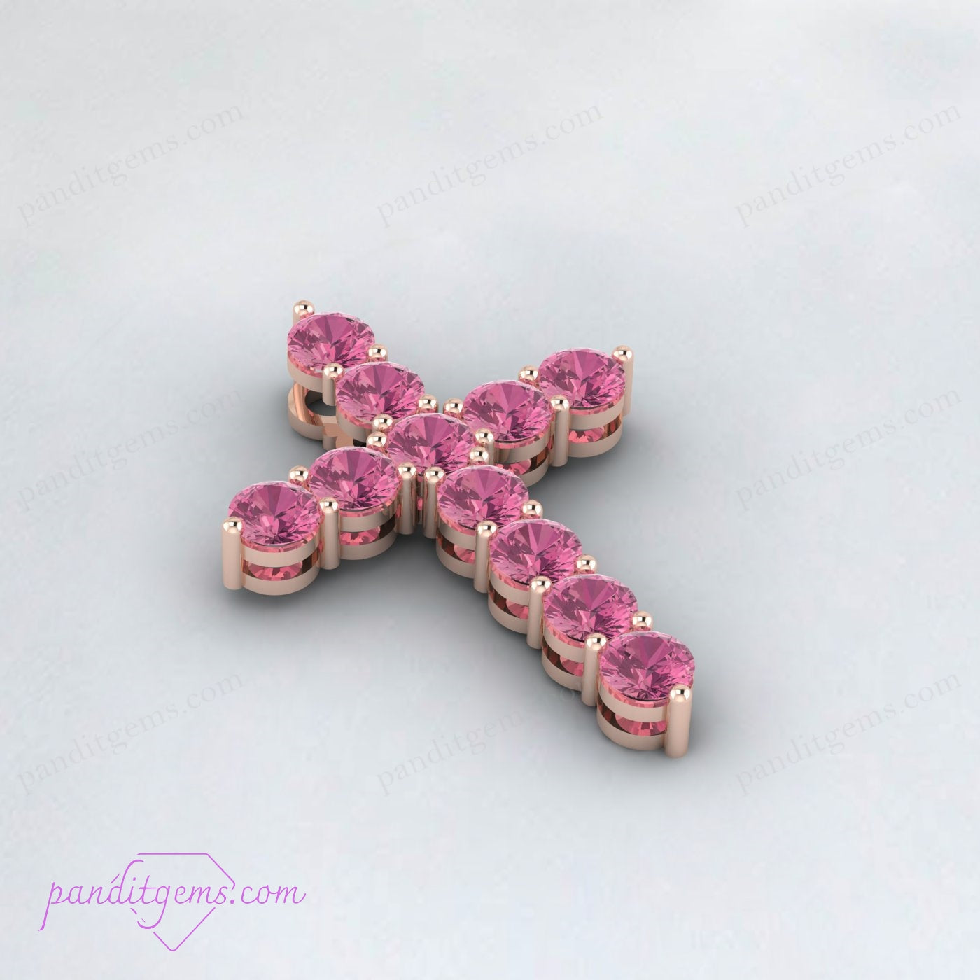 Detailed view of Pink Tourmaline gemstone set in a sterling silver cross pendant, spiritual jewelry.