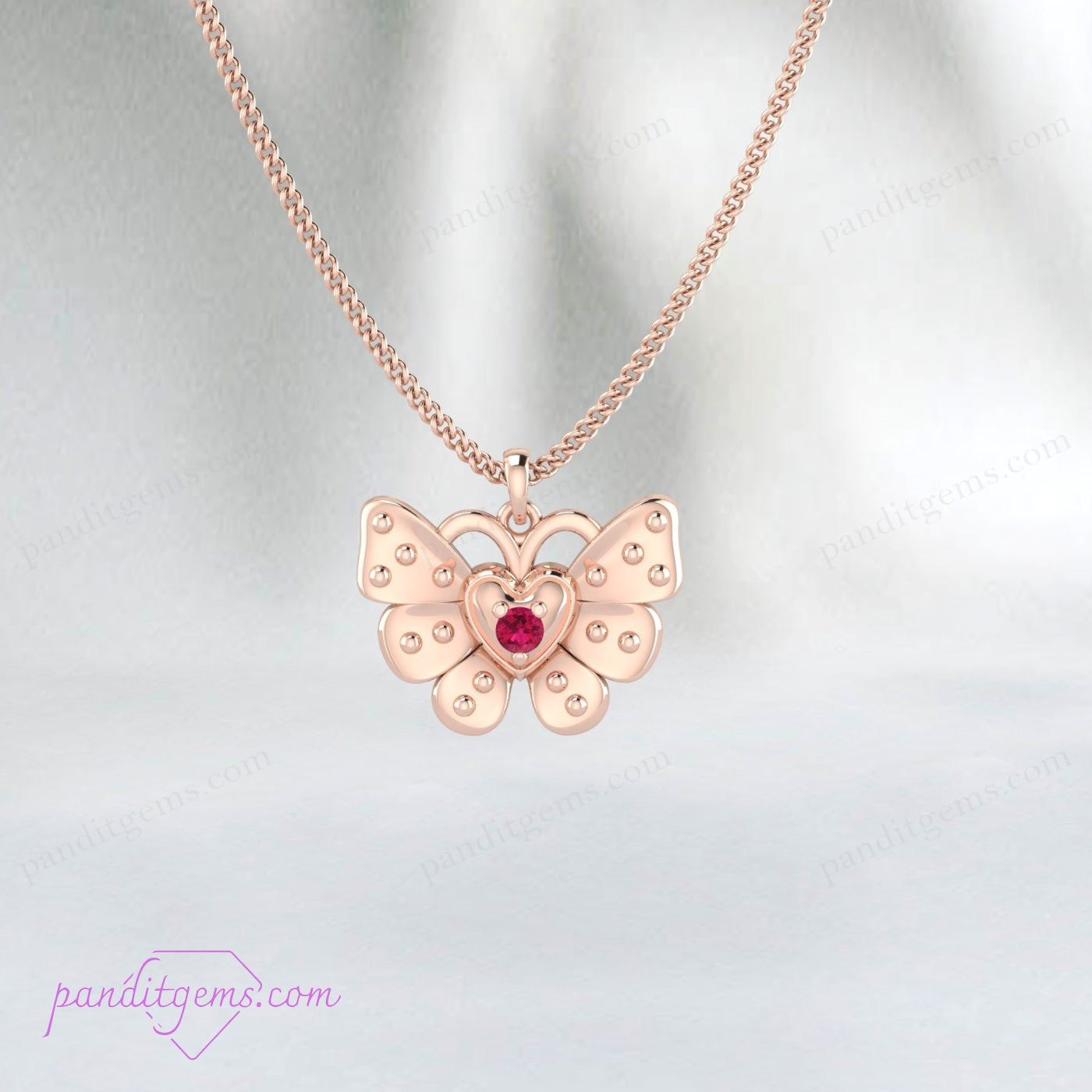 Elegant butterfly necklace featuring a genuine ruby gemstone.