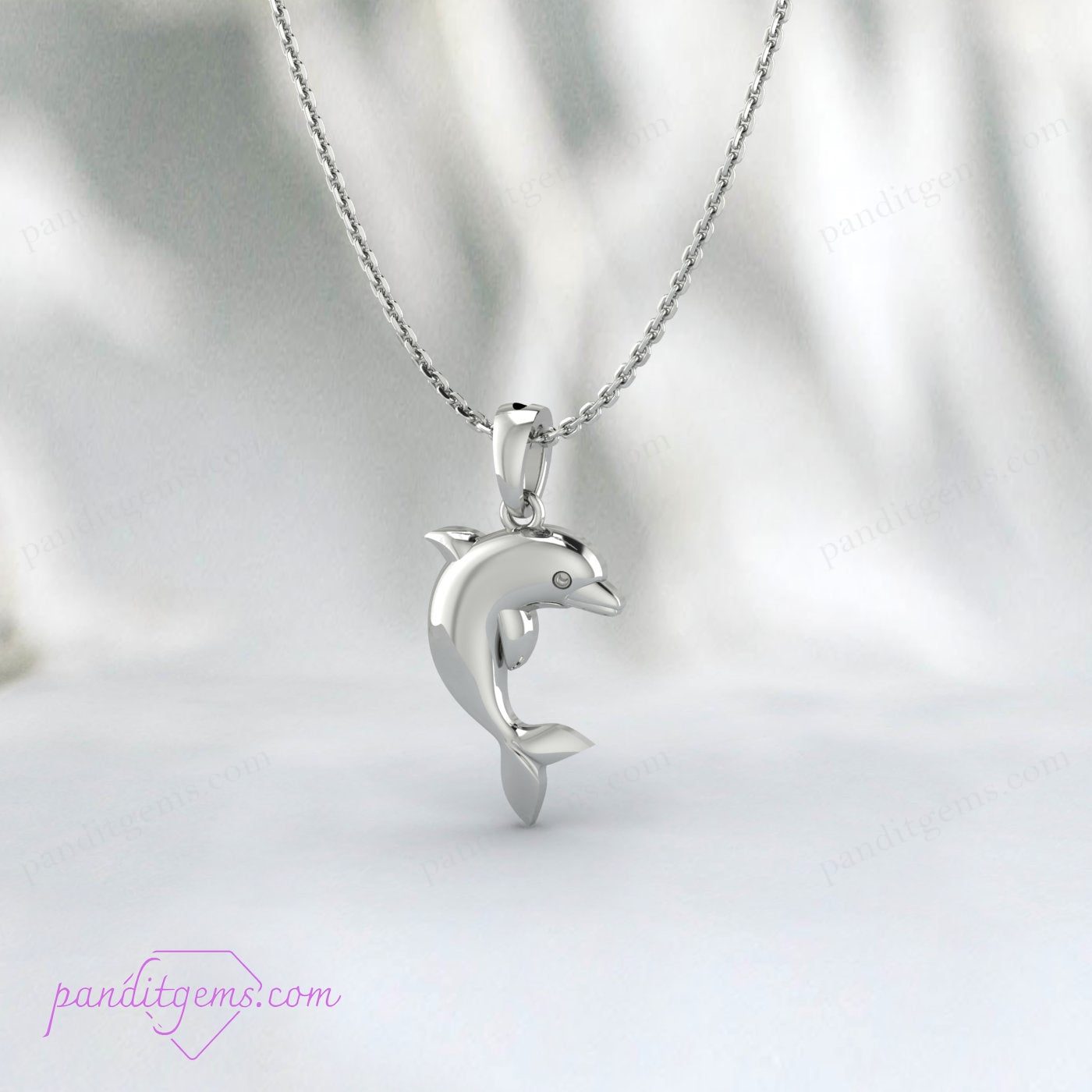 "Elegant sterling silver dolphin charm necklace with realistic design."