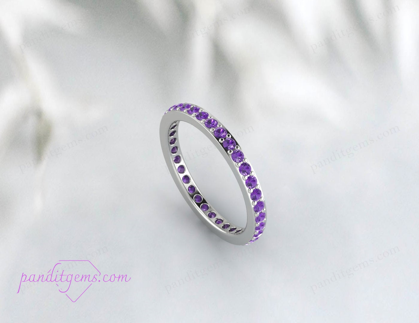 Full eternity band with round-cut purple amethyst stones set in 925 sterling silver. A unique bridal gift for those born in February.