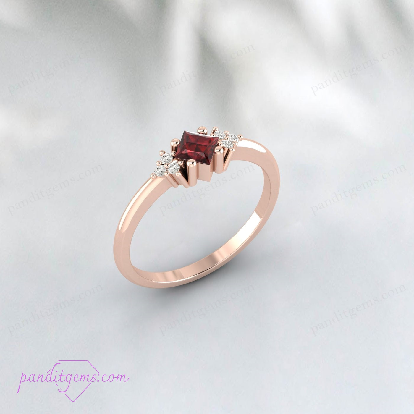 Garnet birthstone ring in sterling silver with a vintage-inspired design and sparkling diamonds.