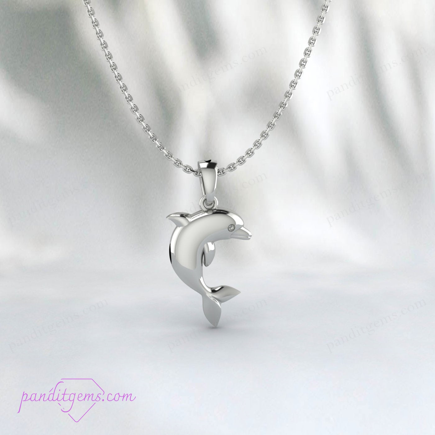 "Gold dolphin pendant necklace for a minimalist marine jewelry collection."