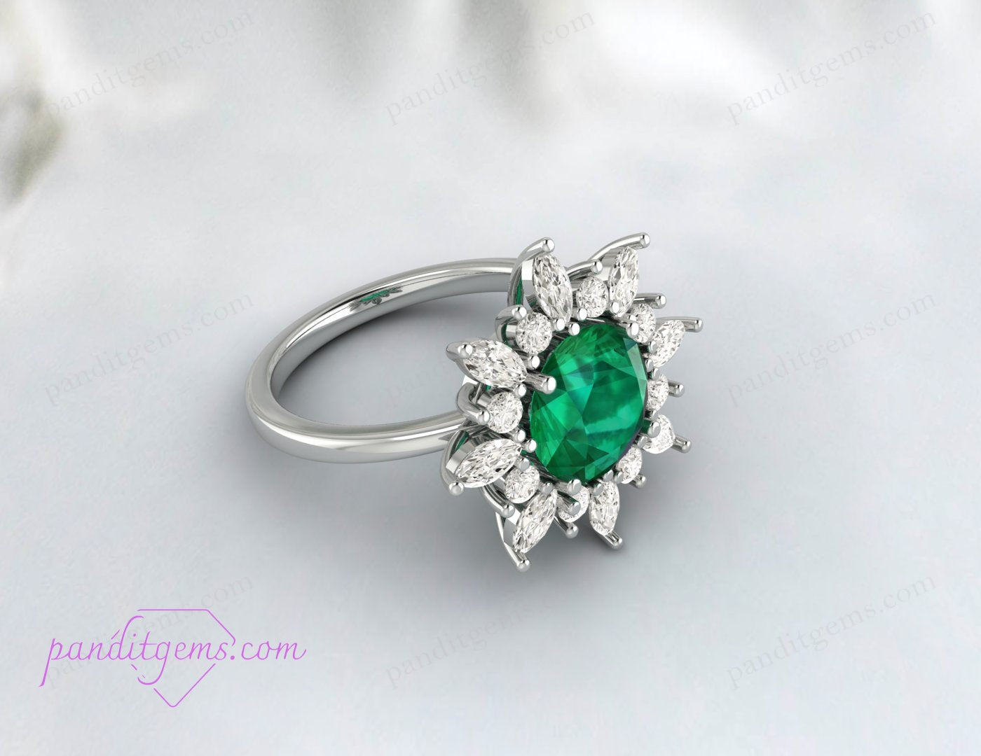 Handcrafted emerald ring with round cut main stone
