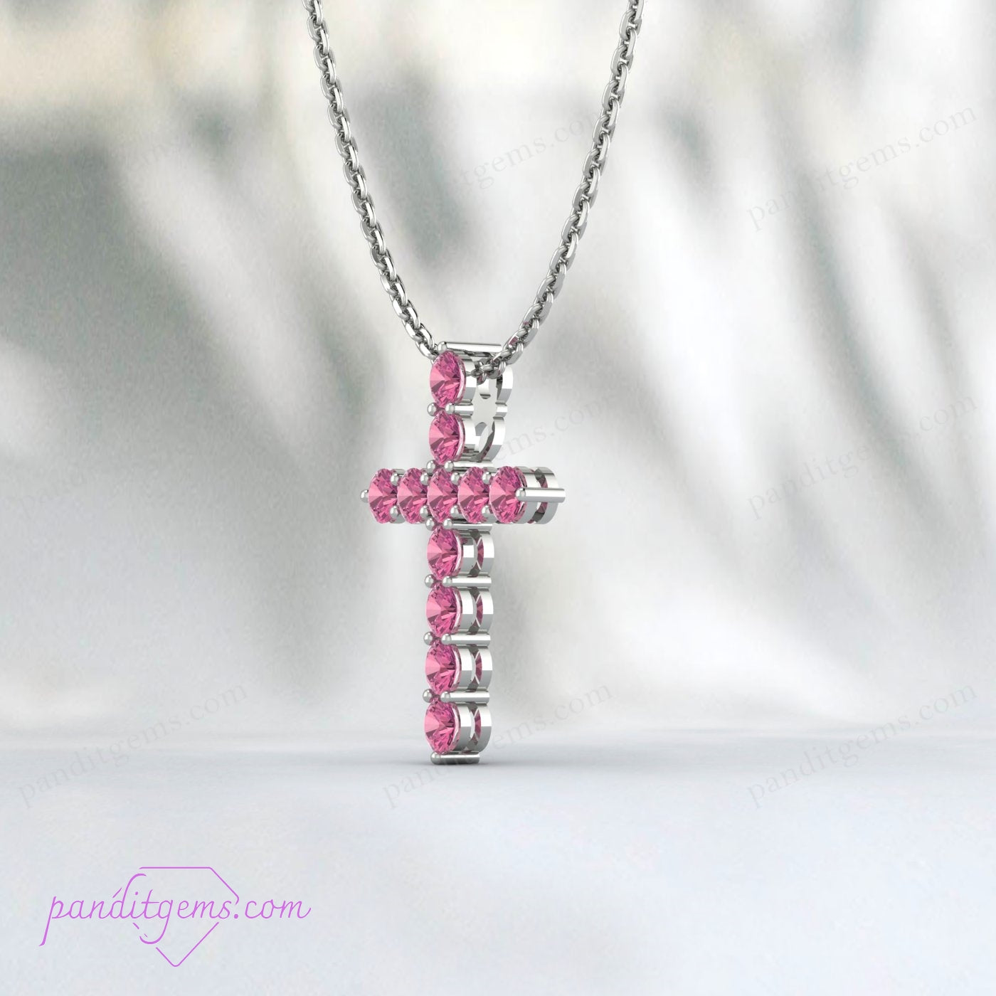 Handcrafted sterling silver cross necklace with a natural Pink Tourmaline gemstone.