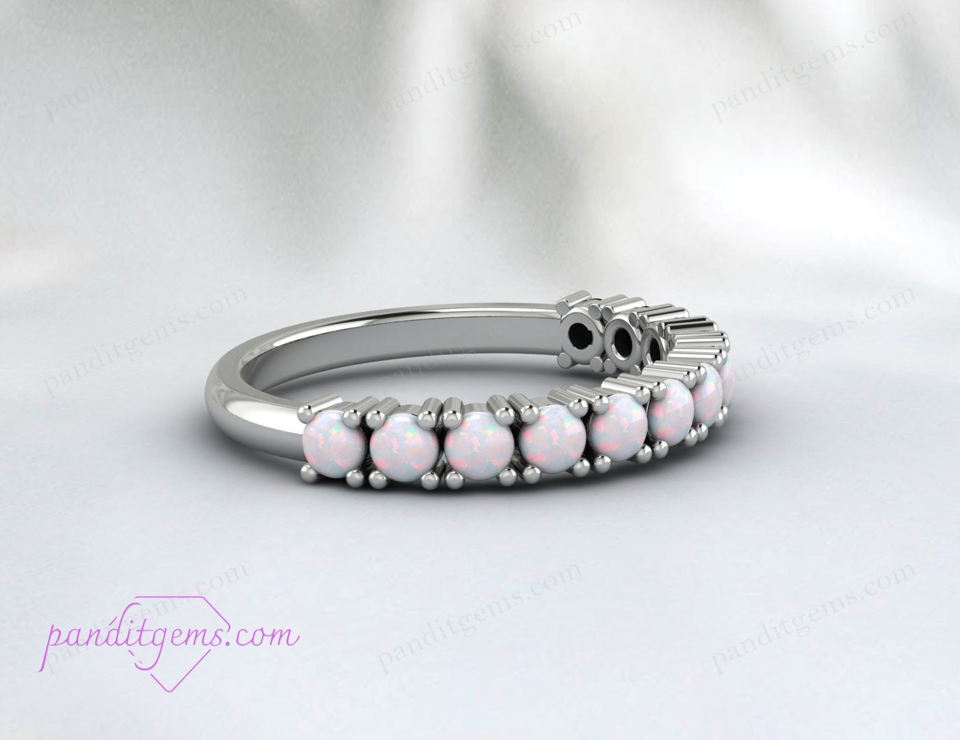 Handmade opal stacking ring with prong-set fire opal stones.