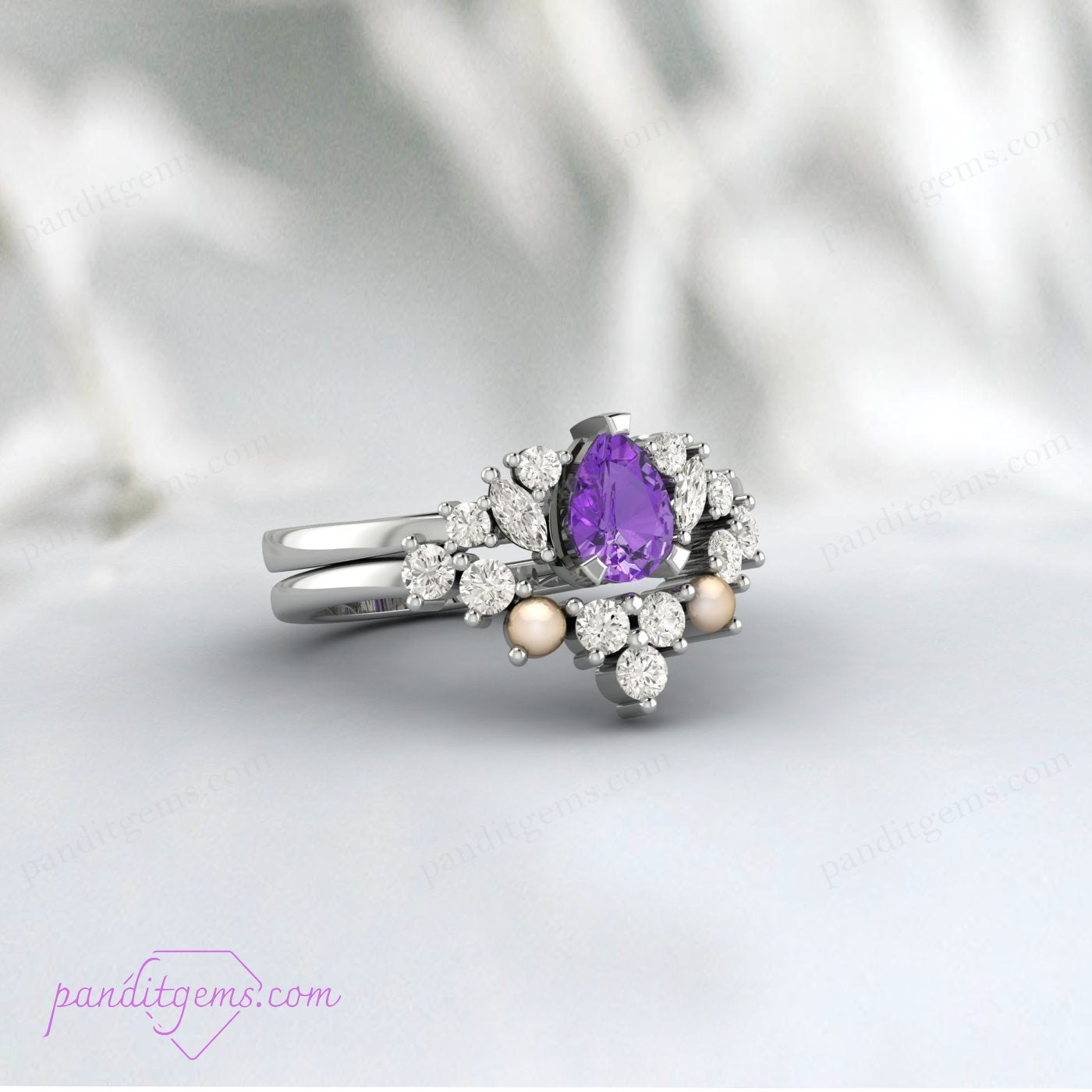 Pear-cut purple amethyst with white pearls and diamonds on a sterling silver wedding band.