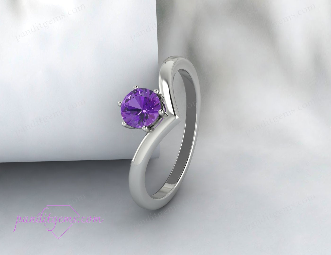 Sterling silver Amethyst solitaire ring with a V-shaped band, showcasing minimalist style with a bold purple gemstone centerpiece.