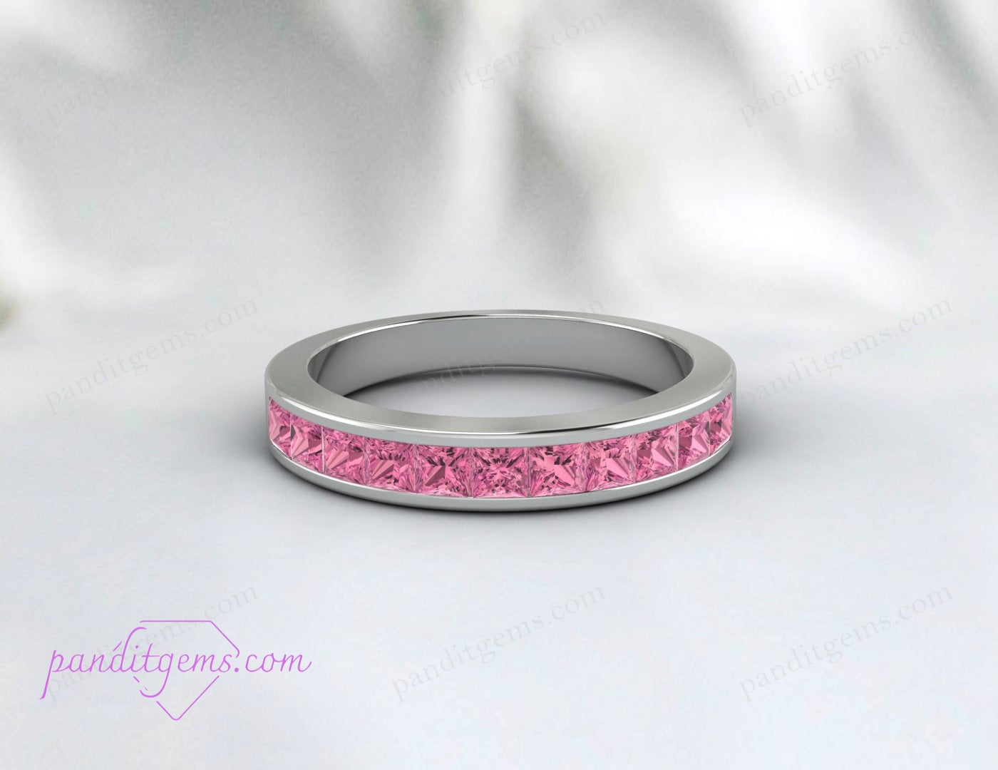 Sterling silver pink tourmaline half-eternity wedding ring.