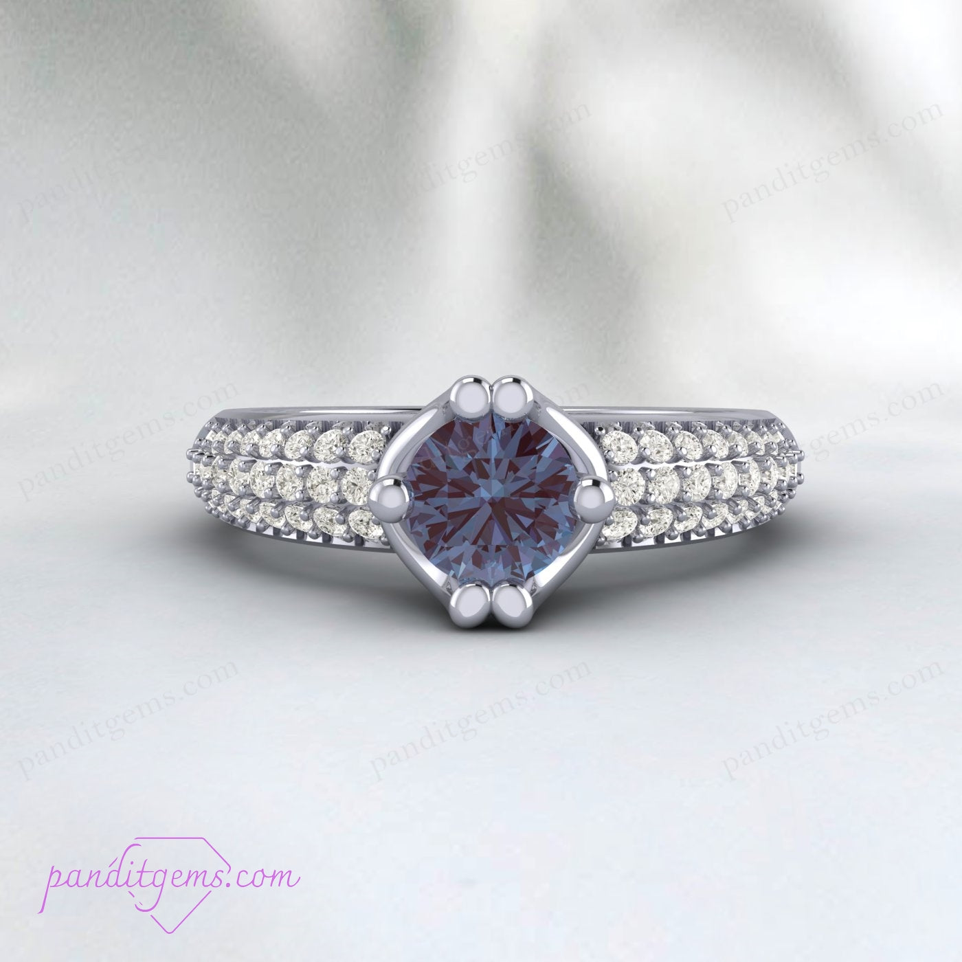 Vintage-style Alexandrite engagement ring with intricate detailing.