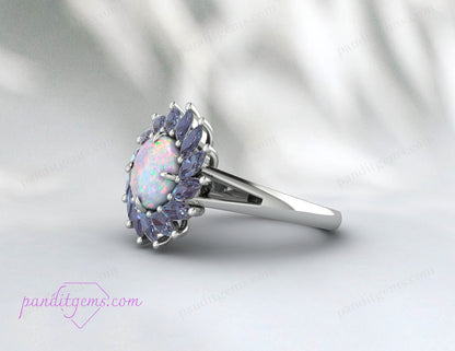 A delicate and vintage-inspired Alexandrite and Opal engagement ring for October birthdays.