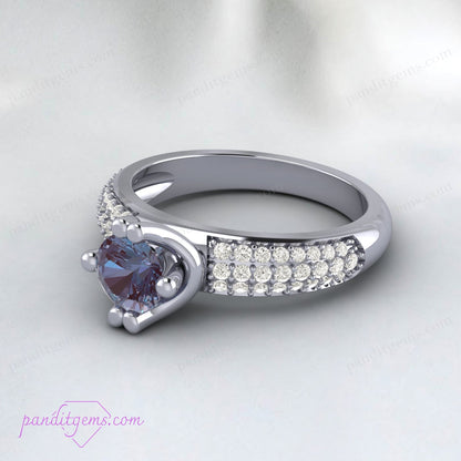 Alexandrite and diamond wedding band with customizable metal options.