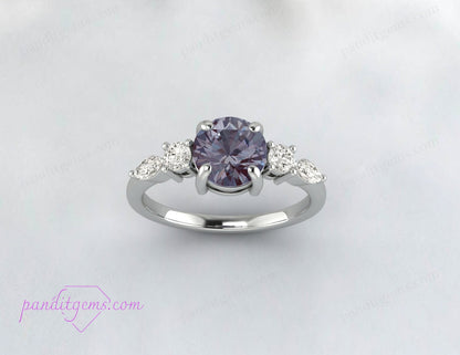 Alexandrite engagement ring with customizable metal options.