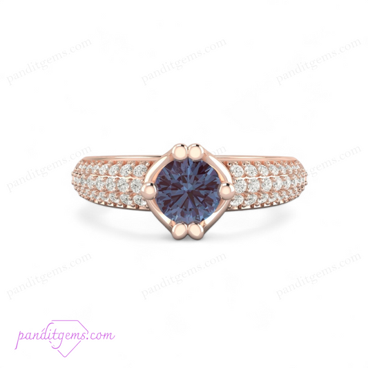Alexandrite engagement ring with simulated diamonds in a sterling silver band.