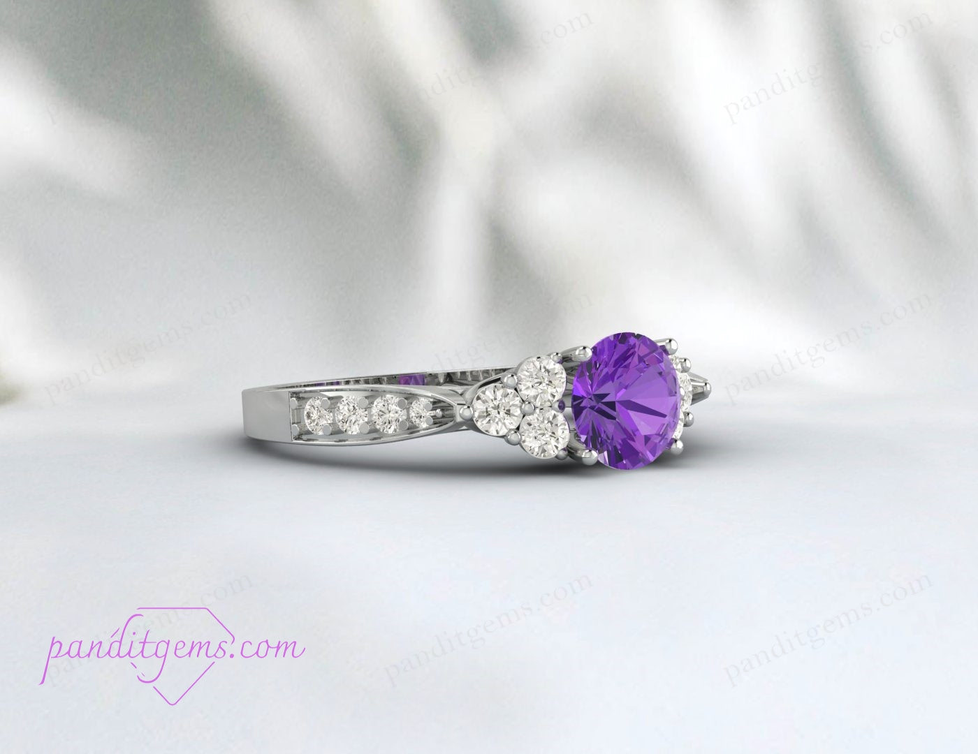 An elegant purple Amethyst ring in a minimalist setting with a sparkling moissanite band.
