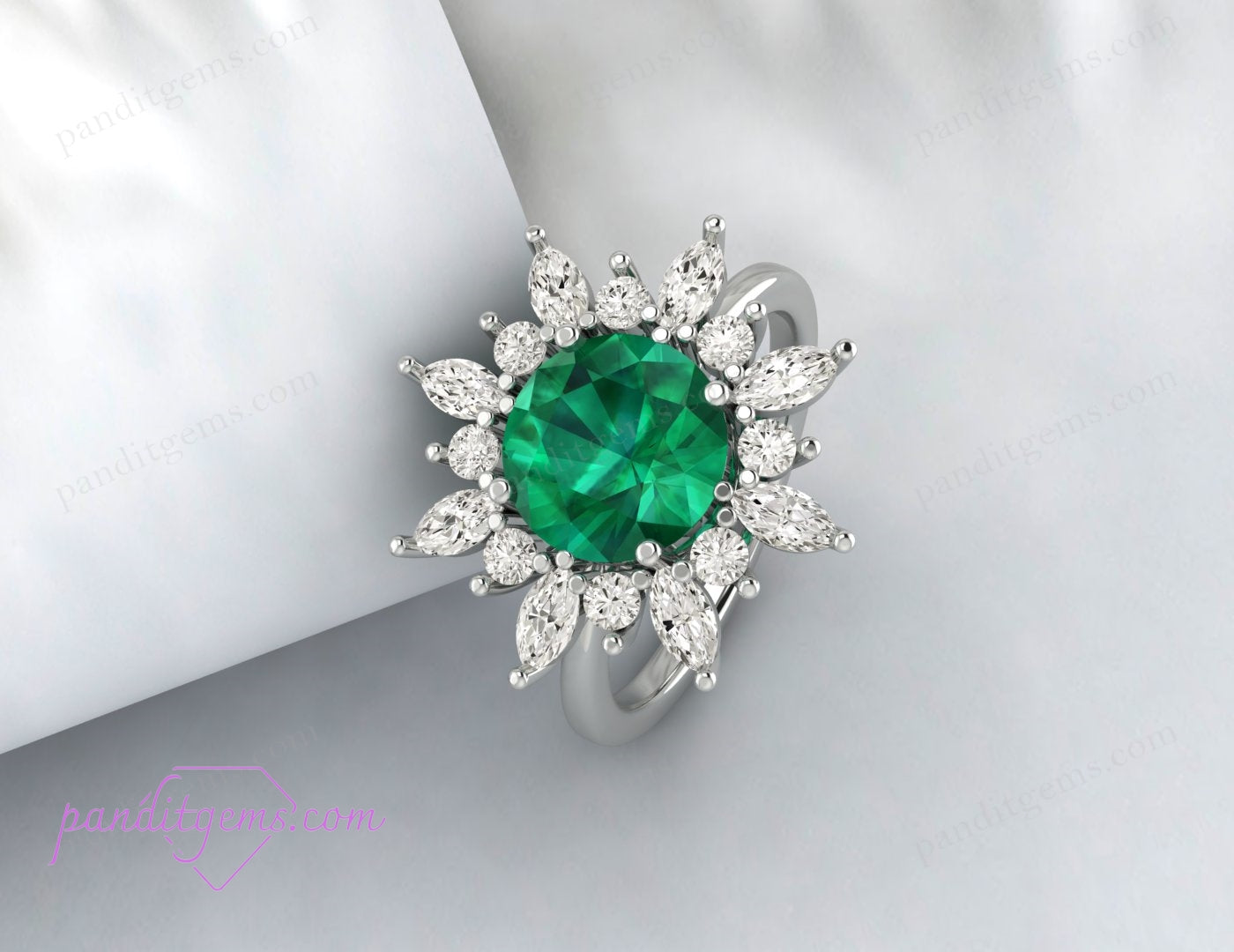 The halo anniversary ring featuring a round cut emerald, ideal as an anniversary gift.