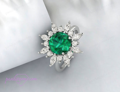 The halo anniversary ring featuring a round cut emerald, ideal as an anniversary gift.