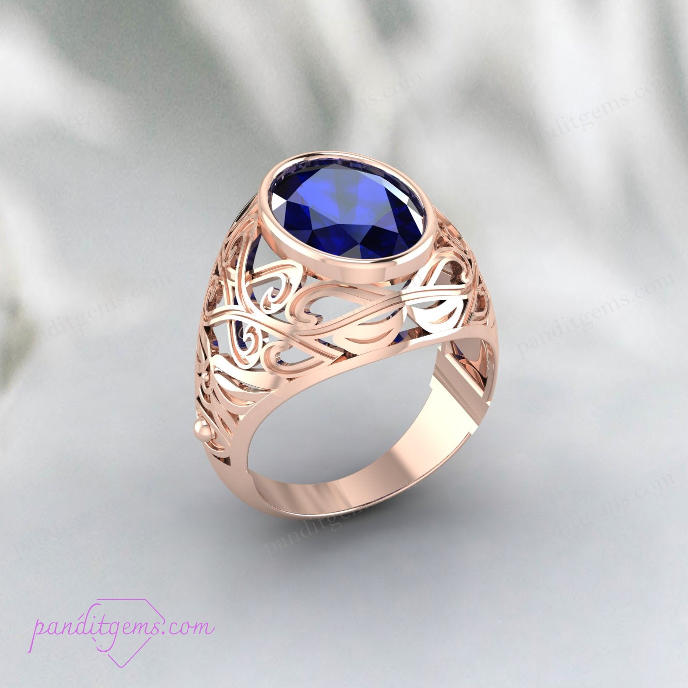 Art Deco Blue Sapphire Ring with detailed silver filigree, featuring an oval cut sapphire and elegant vintage design.