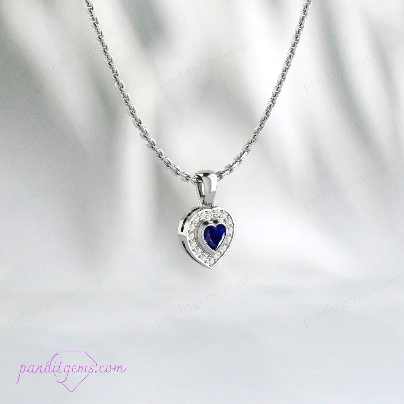 Blue Sapphire Heart Necklace, sterling silver pendant with cubic zirconia accents.