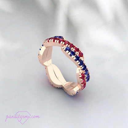 Close-up of a Blue Sapphire and Ruby Infinity Wedding Band, showcasing the intricate twist and brilliant gemstones.