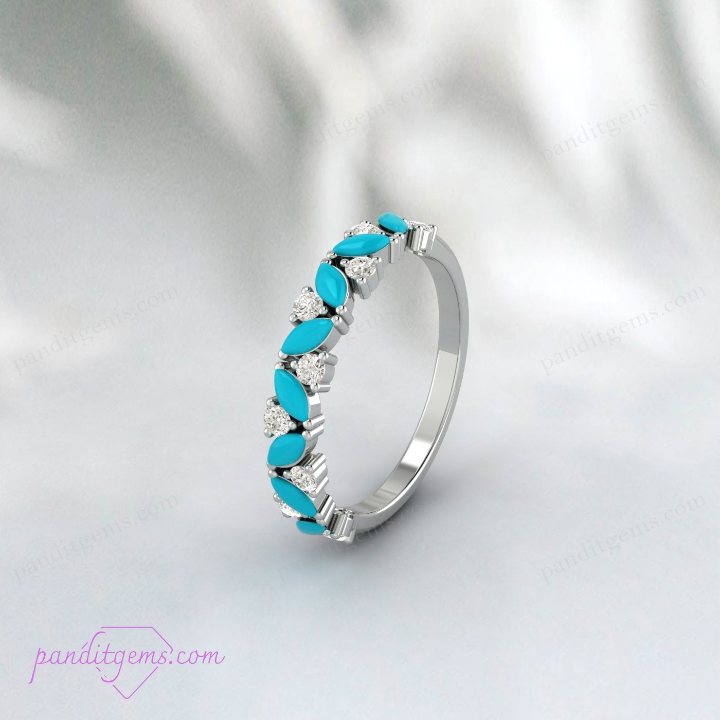 A close-up view of a turquoise and diamond half eternity band with an art deco design