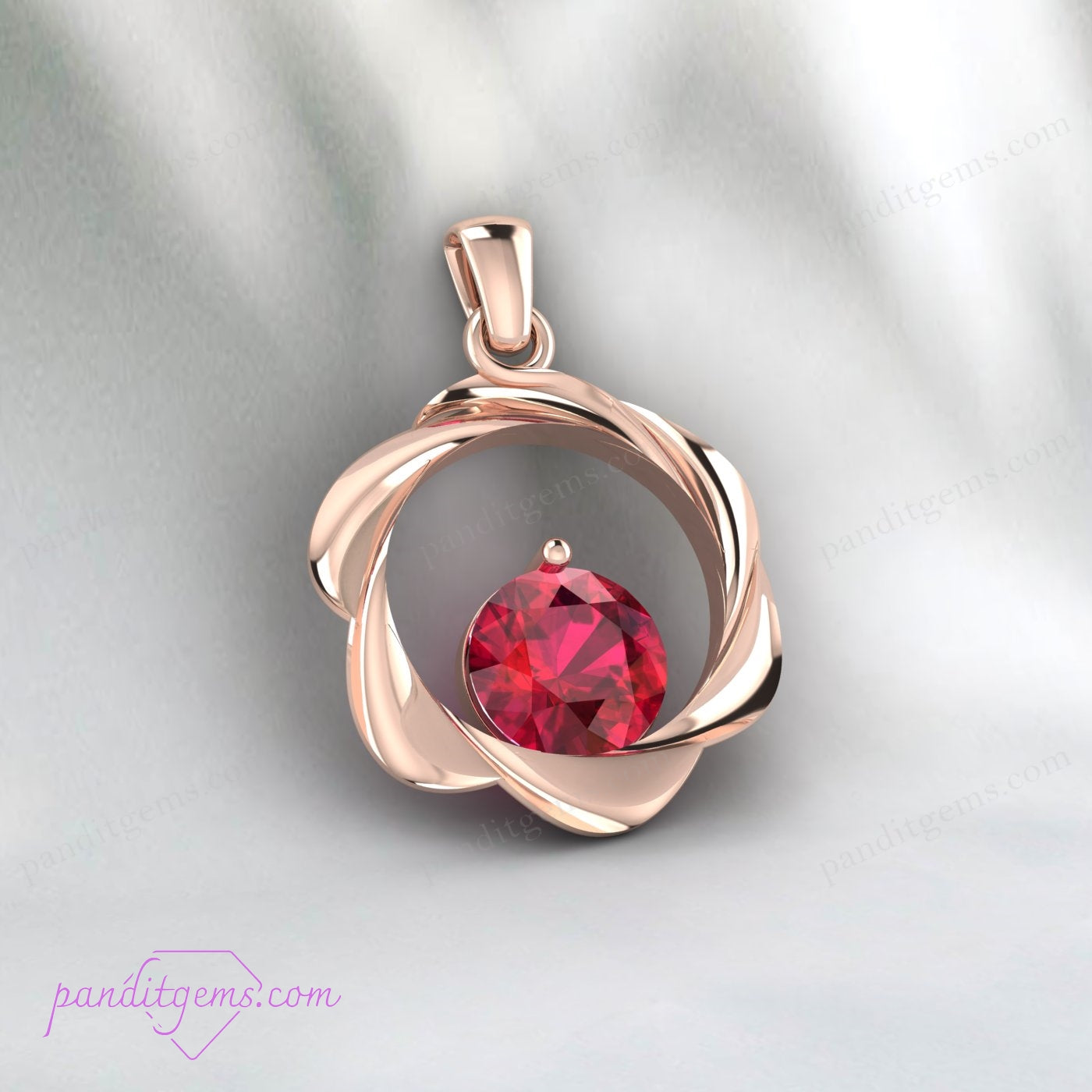 Created ruby pendant in round cut, gold-plated sterling silver.