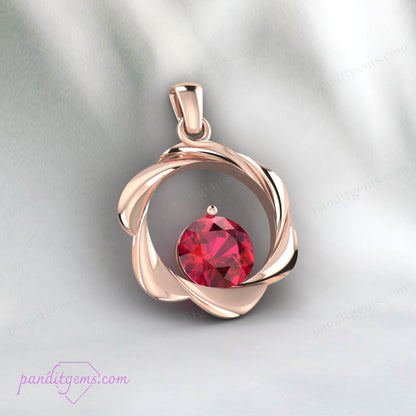 Created ruby pendant in round cut, gold-plated sterling silver.