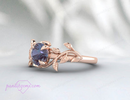 A sterling silver ring with rose gold plating and a central Alexandrite stone.