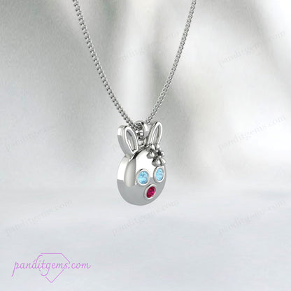 Cute bunny pendant with Aquamarine, Ruby, and Onyx on a sterling silver chain, handcrafted with precision.