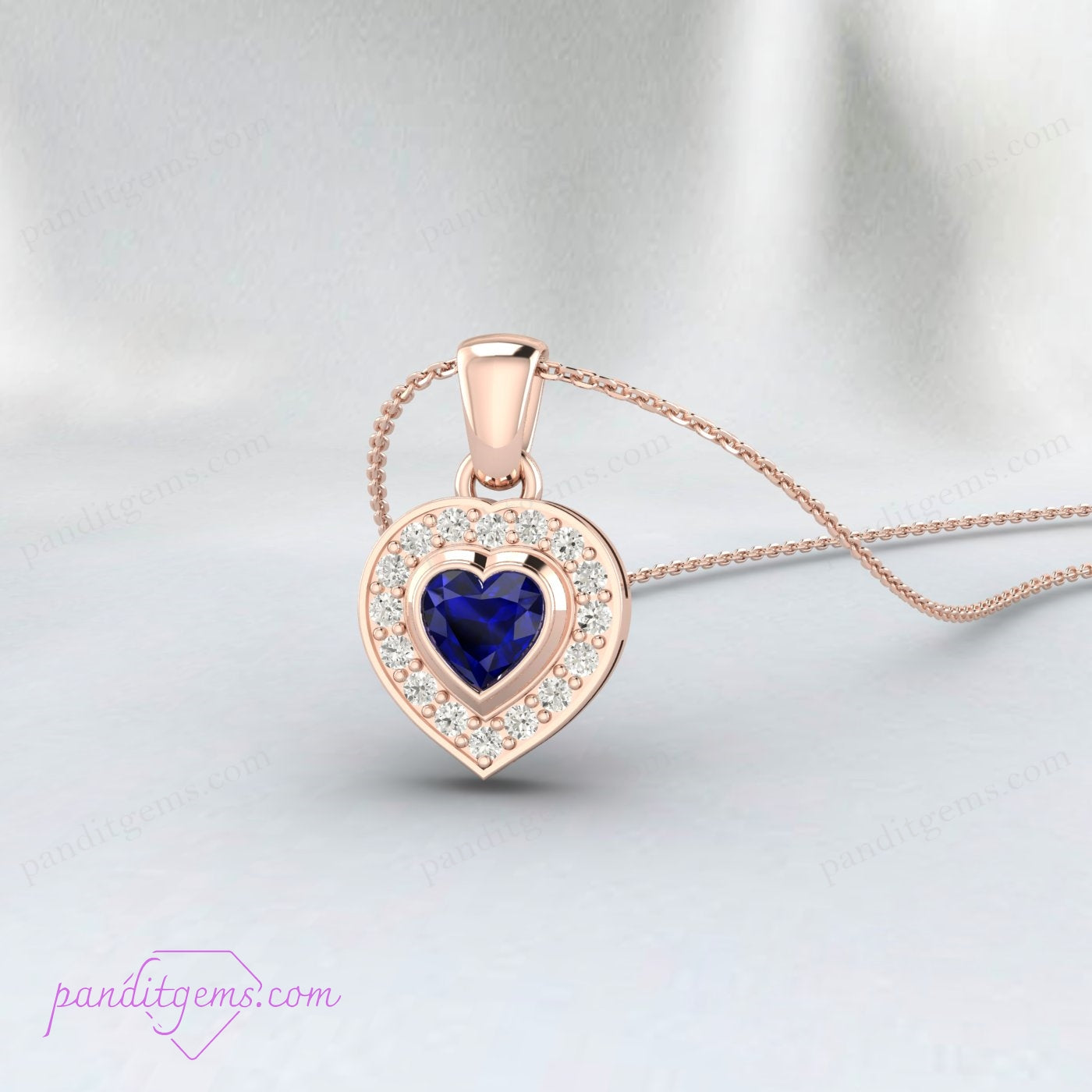 Dainty heart-shaped sapphire necklace in sterling silver, featuring a halo of cubic zirconia.