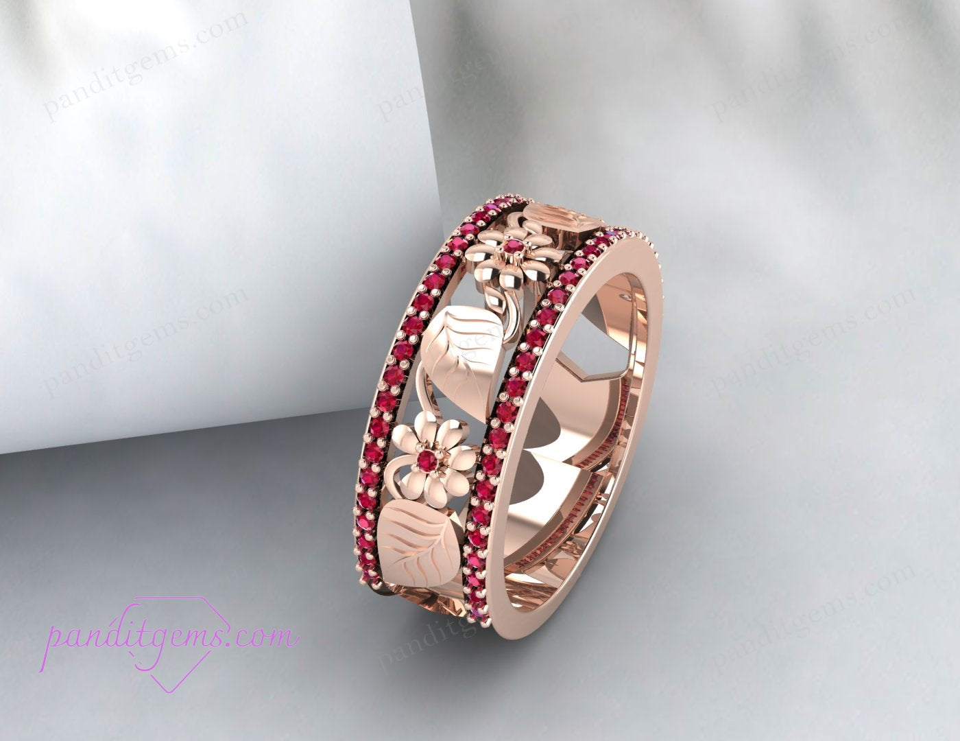 A detailed shot focusing on the intricate leaf design of the wedding band.