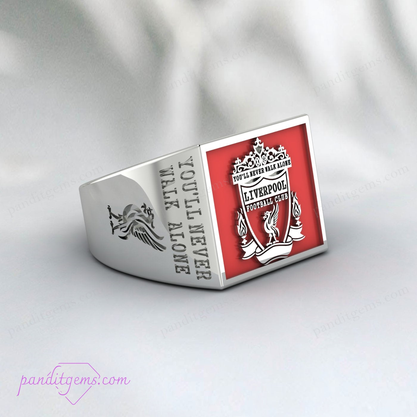 Detailed shot of the Liverpool FC logo in red enamel on sterling silver ring.