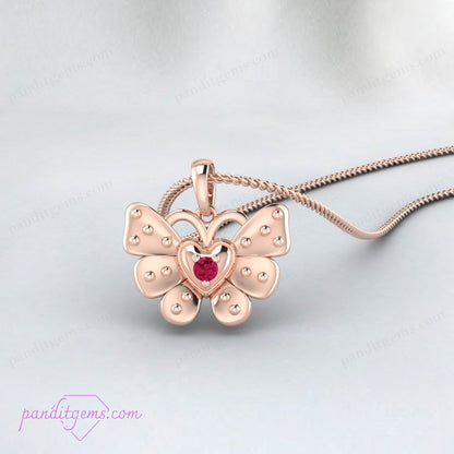 Detailed view of a 925 sterling silver butterfly charm with a ruby.