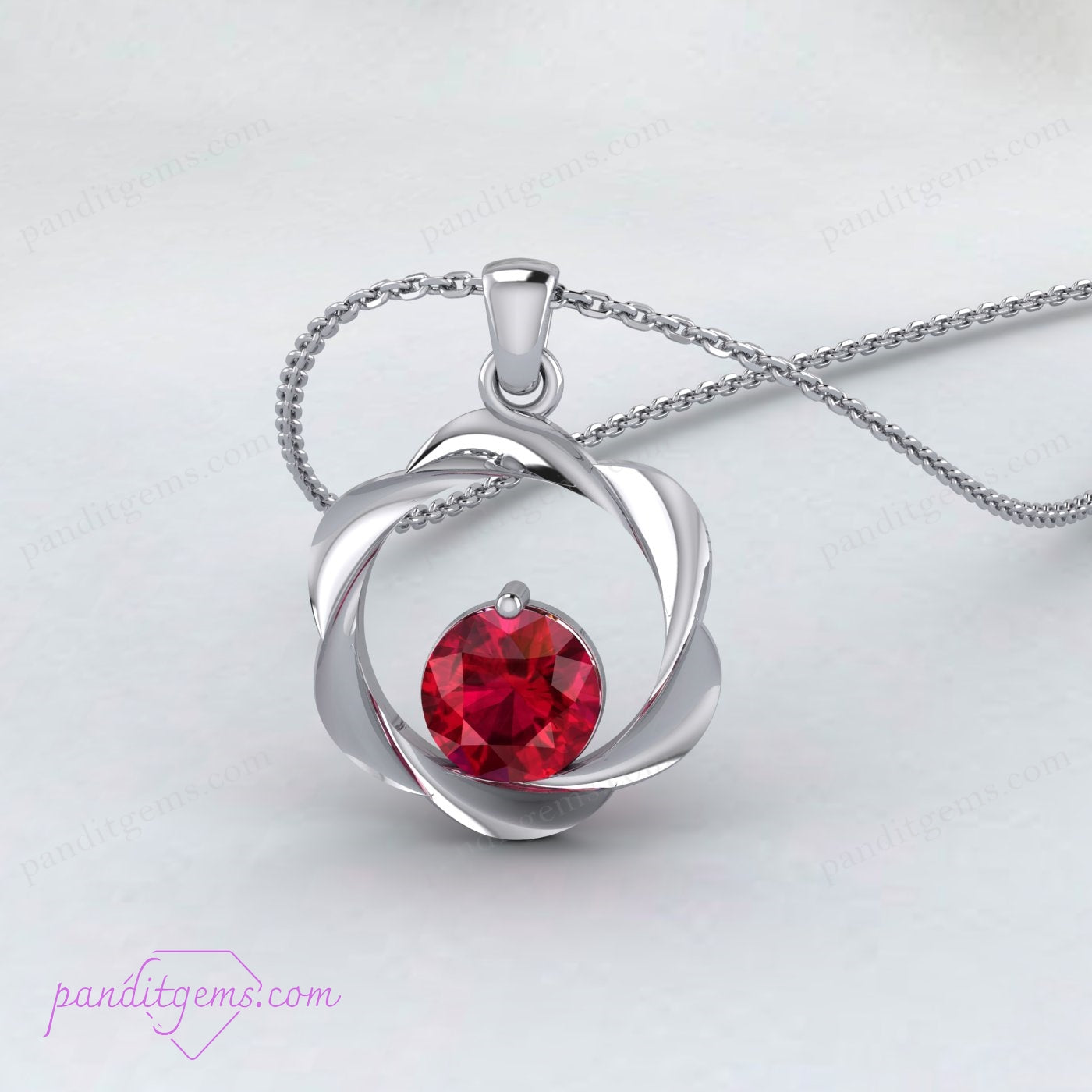 Detailed view of vintage ruby pendant in gold vermeil.
