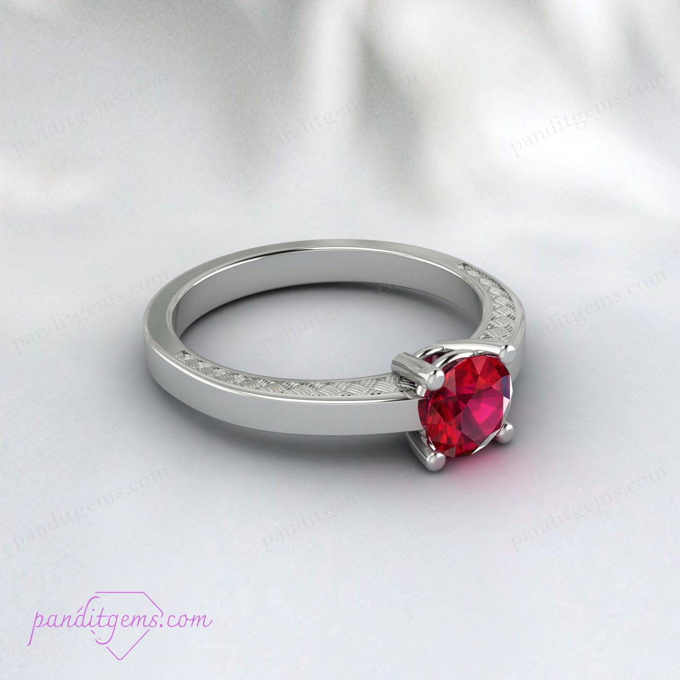 Elegant ruby solitaire ring set in a Victorian-style band.