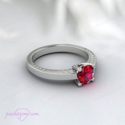 Elegant ruby solitaire ring set in a Victorian-style band.