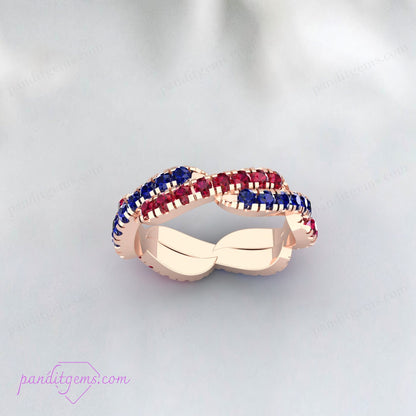 Elegant twisted wedding band with Blue Sapphire and Ruby gemstones, crafted in sterling silver.