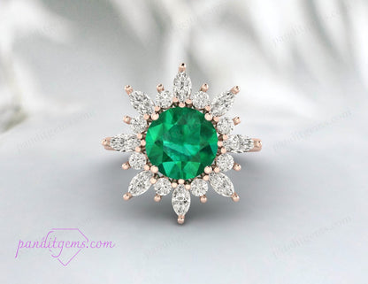 A round cut emerald ring designed as a promise ring for love.