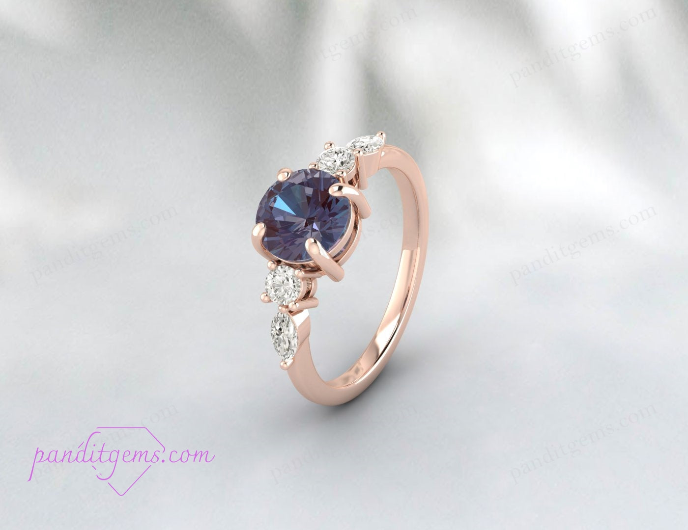 Engagement ring with round Alexandrite and simulated diamonds.