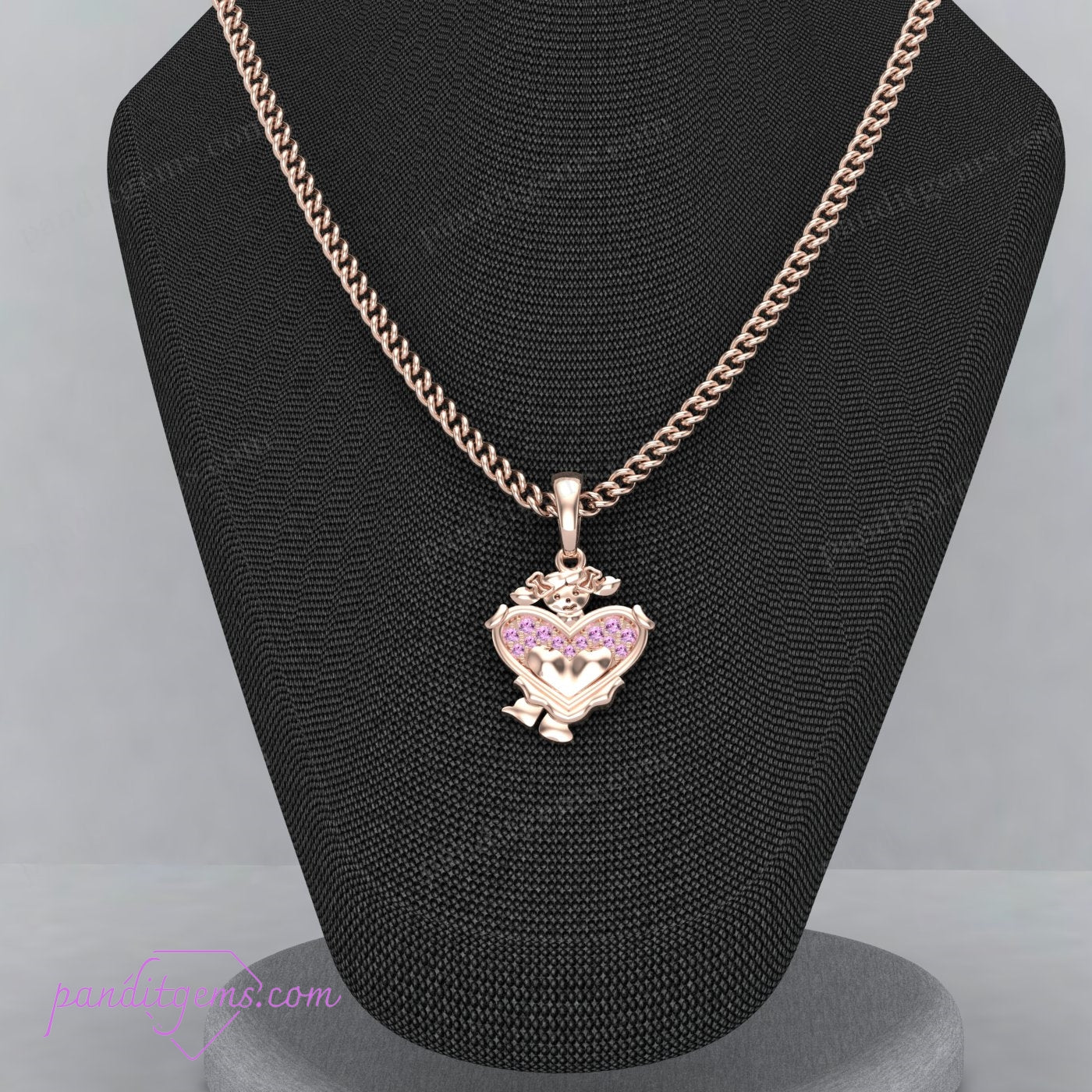 A gold heart pendant adorned with micro pave pink sapphires.