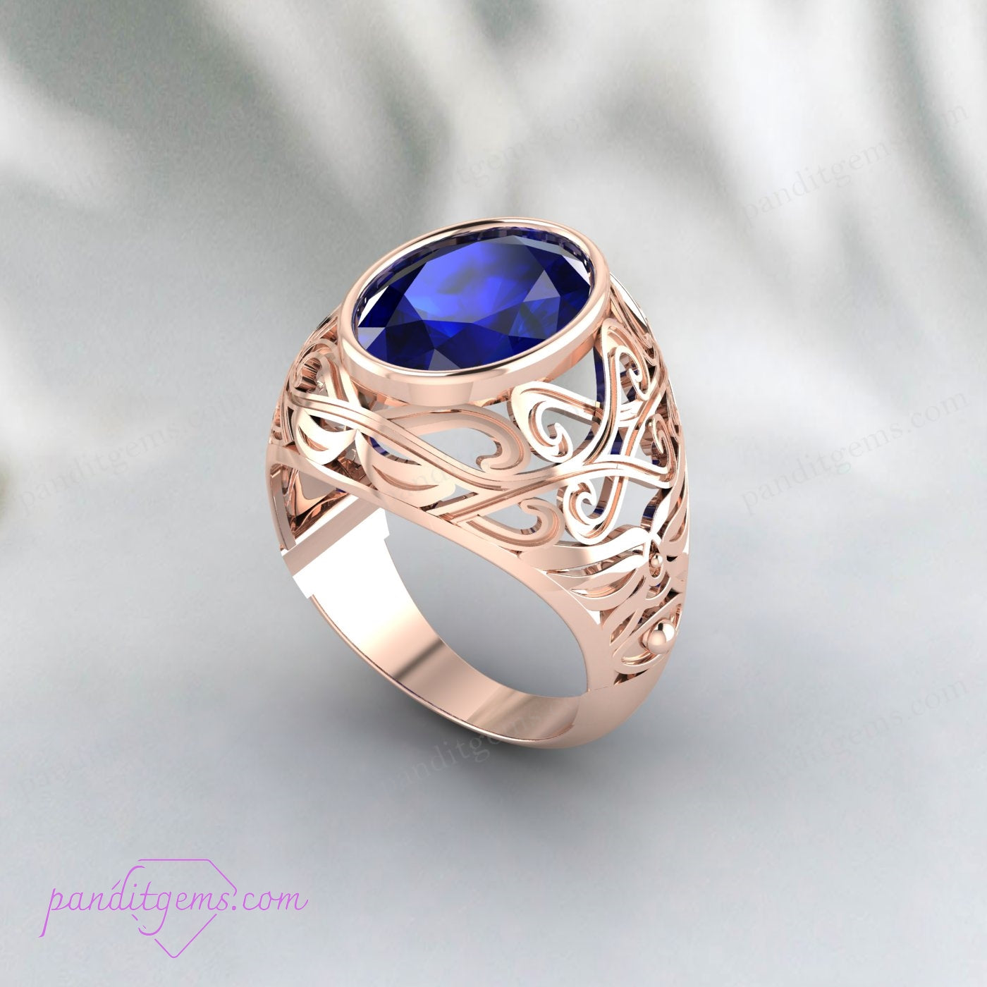 Hand model wearing a Vintage Blue Sapphire Solitaire Ring, highlighting the intricate filigree work and oval sapphire.